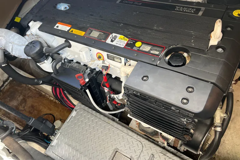 Slide: The Image of Engine compartment of a 2008 Four Winns V378 boat, featuring a Volvo Penta engine. - 44