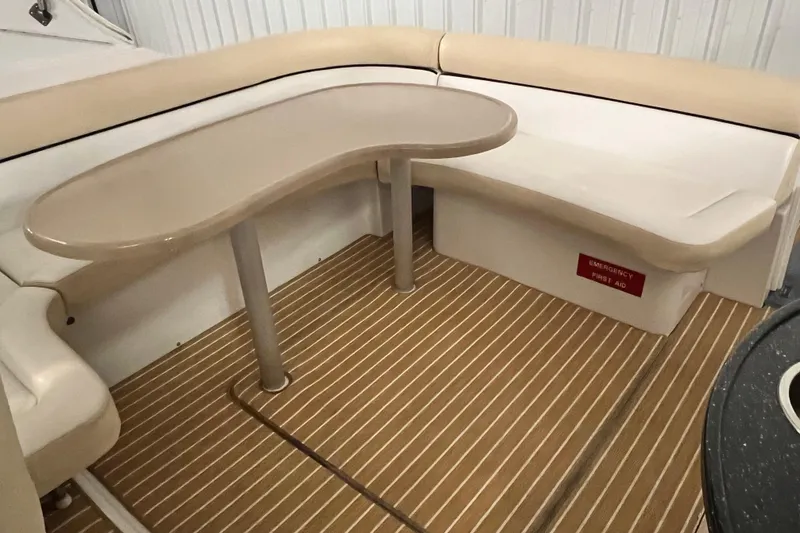 Slide: The Image of 2008 Four Winns V378 boat interior with beige seating and table. - 5