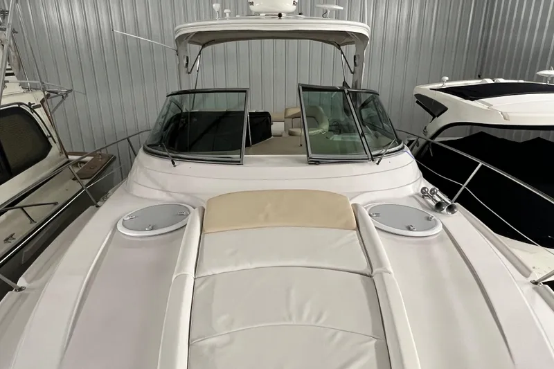 Slide: The Image of 2008 Four Winns V378 yacht in storage, featuring sleek design and spacious deck. - 9