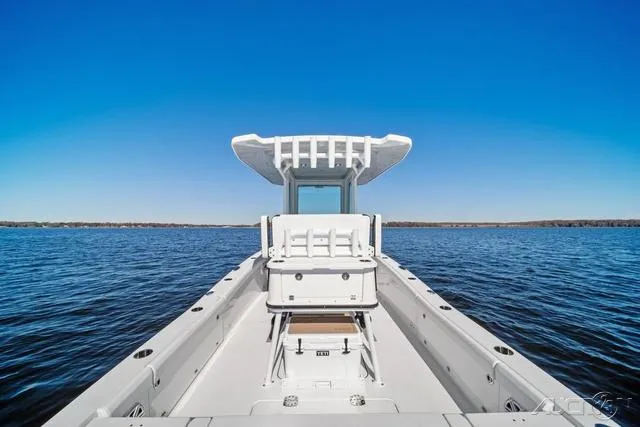 Slide: The Image of 2025 Blackfin 262 HB boat on open water under clear blue sky. - 10
