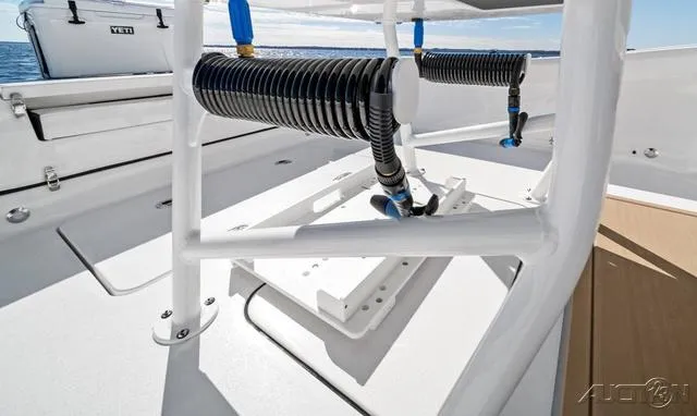 Slide: The Image of 2025 Blackfin 262 HB boat deck with mounted equipment and ocean view. - 13