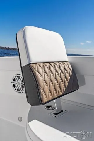Slide: The Image of 2025 Blackfin 262 HB boat seat with quilted design, set against a clear blue sky. - 14