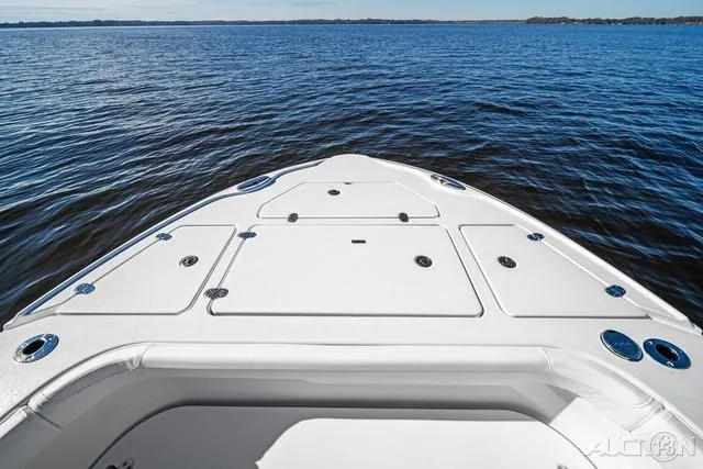 Slide: The Image of 2025 Blackfin 262 HB boat on calm water, showcasing spacious deck design. - 3