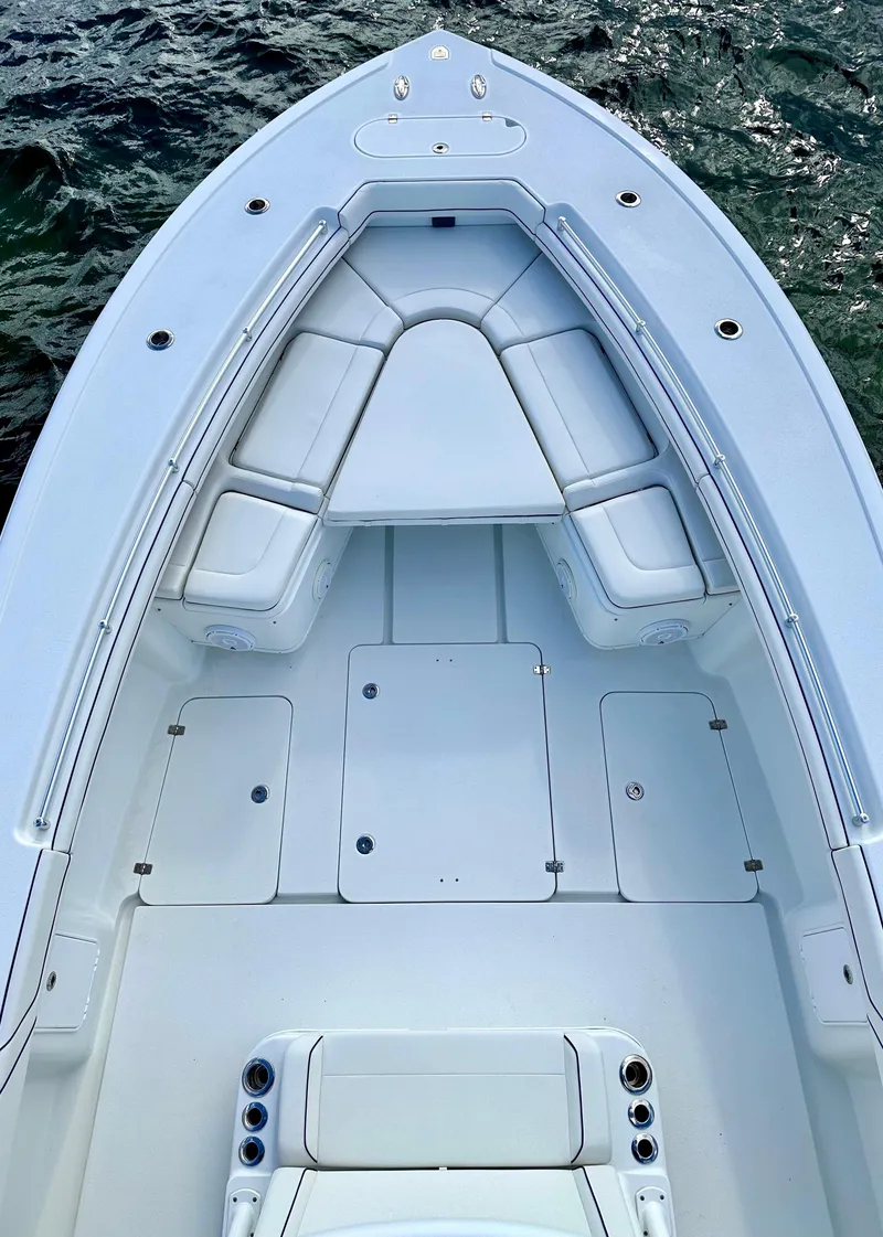 Slide: The Image of 2017 Yellowfin 39 Offshore boat deck with cushioned seating, viewed from above. - 11