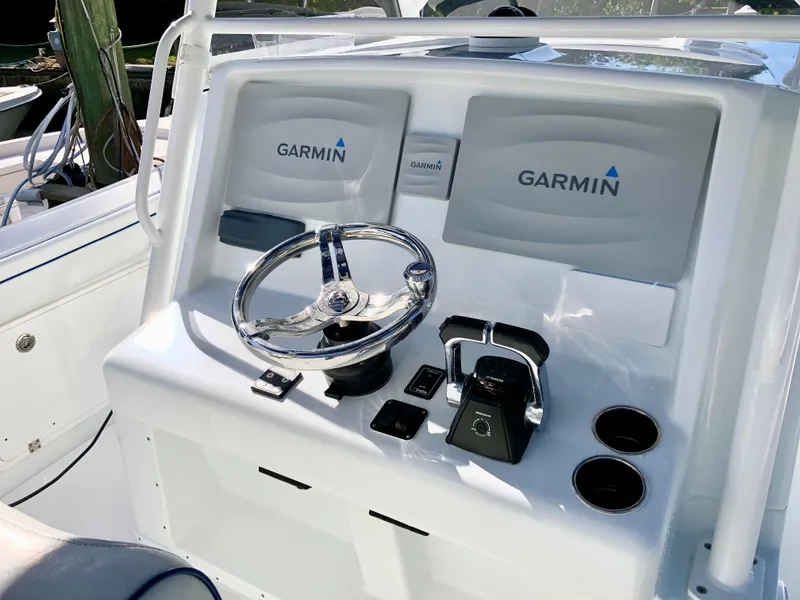 Slide: The Image of 2017 Yellowfin 39 Offshore boat console with Garmin navigation system and steering wheel. - 21