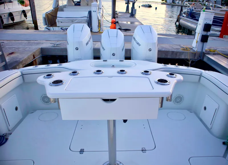 Slide: The Image of 2017 Yellowfin 39 Offshore boat with triple outboard engines at dock. - 27