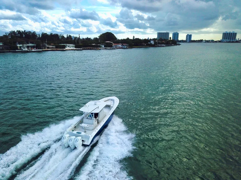 Slide: The Image of 2017 Yellowfin 39 Offshore boat cruising on a scenic waterway. - 7