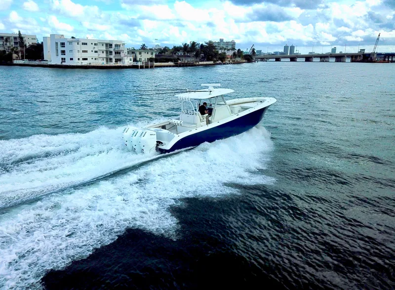 Slide: The Image of 2017 Yellowfin 39 Offshore boat cruising on a scenic waterway. - 9