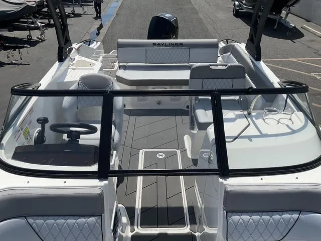 Slide: The Image of 2025 Bayliner D22 boat interior with seating, steering wheel, and modern design. - 13