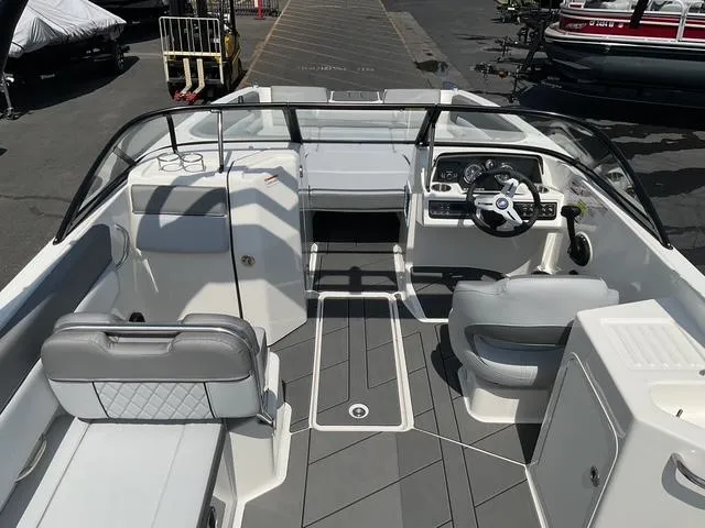 Slide: The Image of 2025 Bayliner D22 boat interior with modern seating and dashboard design. - 14