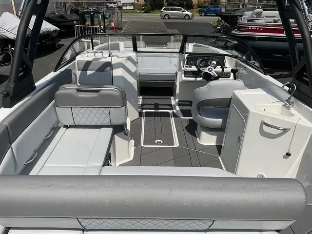 Slide: The Image of 2025 Bayliner D22 boat interior with modern seating and steering console. - 15