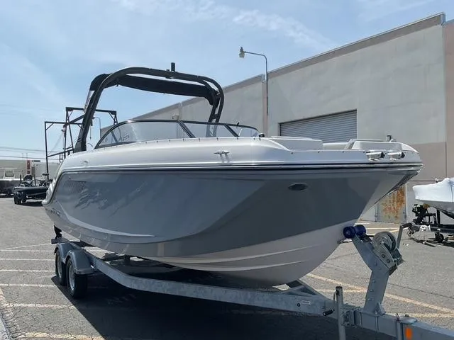 Slide: The Image of 2025 Bayliner D22 boat on trailer, parked outdoors. - 4