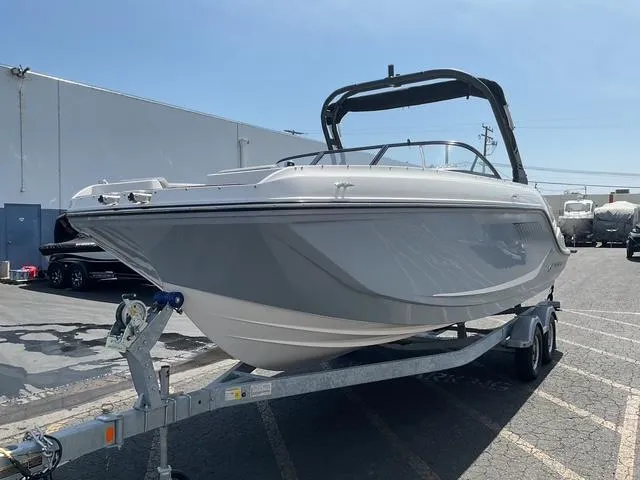 Slide: The Image of 2025 Bayliner D22 boat on trailer, parked outdoors under clear sky. - 5