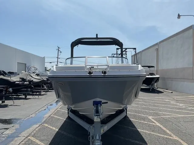 Slide: The Image of 2025 Bayliner D22 boat on trailer in parking lot, front view. - 6