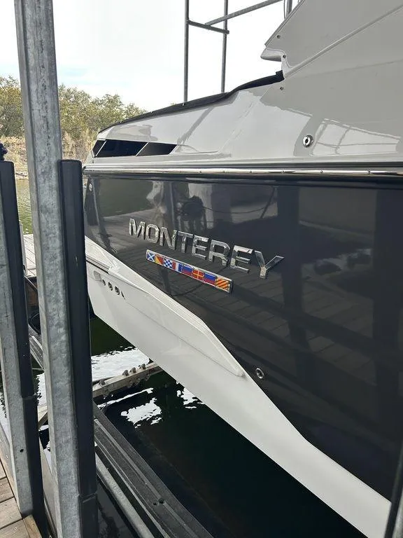 Slide: The Image of 2023 Monterey 378SS boat docked, showcasing sleek design and branding. - 11