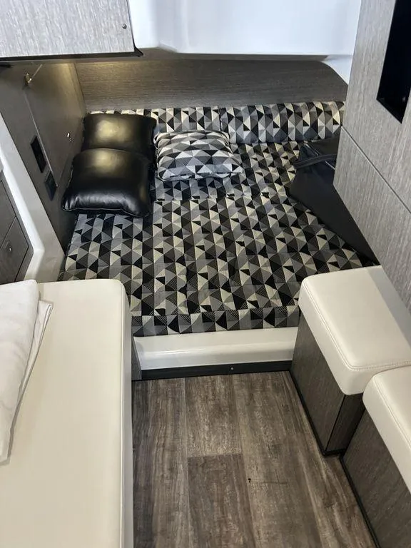Slide: The Image of 2023 Monterey 378SS interior with geometric-patterned bedding and modern design. - 12