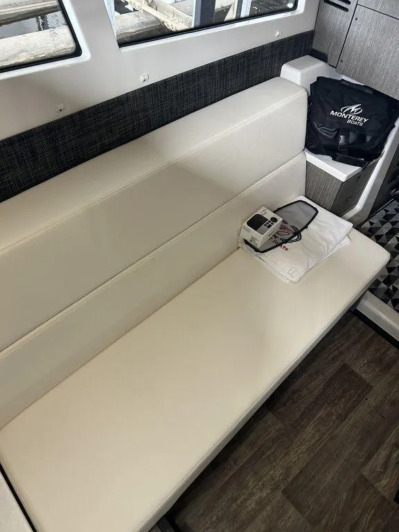 Slide: The Image of 2023 Monterey 378SS interior with cream seating and modern design elements. - 14