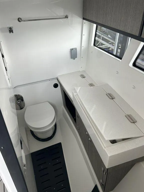 Slide: The Image of 2023 Monterey 378SS boat bathroom interior with modern fixtures and cabinetry. - 22