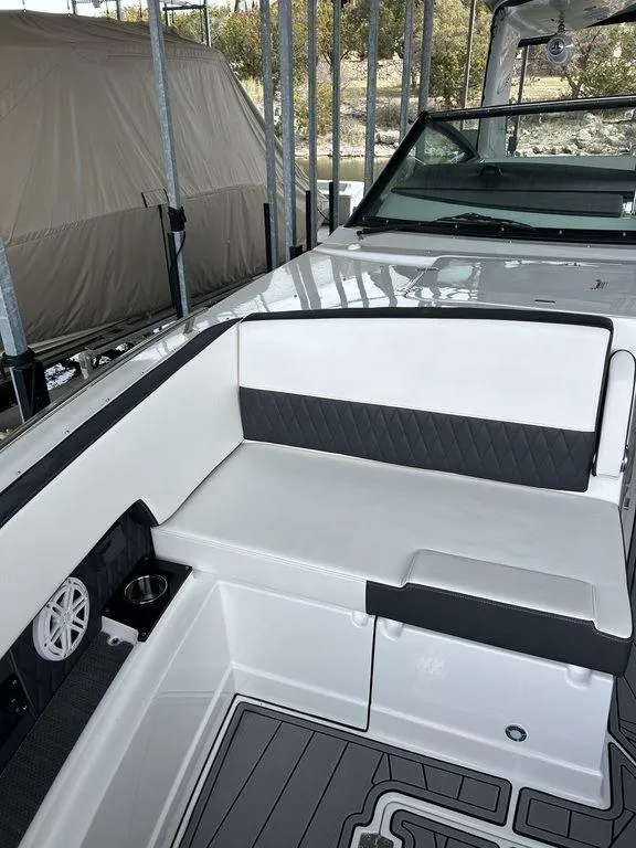 Slide: The Image of 2023 Monterey 378SS boat interior with white seating and modern design. - 26