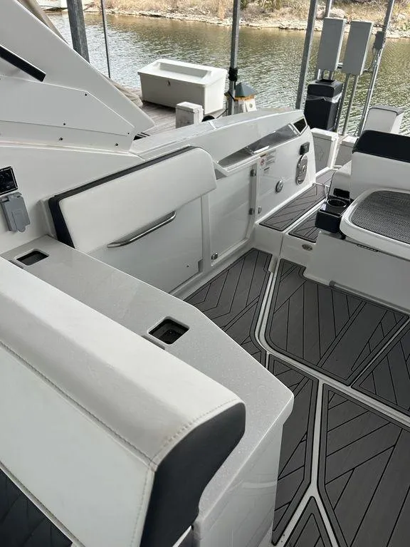 Slide: The Image of 2023 Monterey 378SS boat interior with sleek seating and modern design. - 34