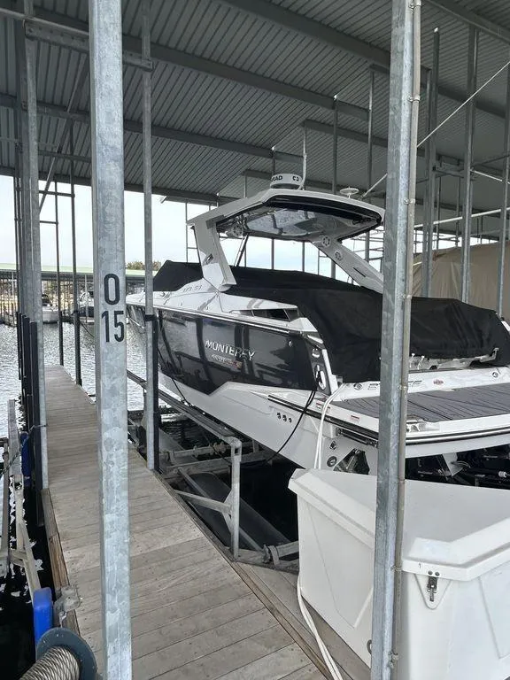 Slide: The Image of 2023 Monterey 378SS boat docked in a covered marina. - 4