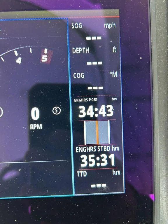 Slide: The Image of Dashboard display of a 2023 Monterey 378SS boat showing engine hours and other metrics. - 48