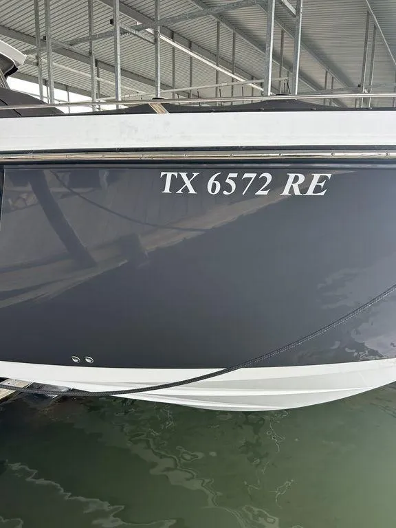 Slide: The Image of 2023 Monterey 378SS boat docked, displaying registration number TX 6572 RE. - 7