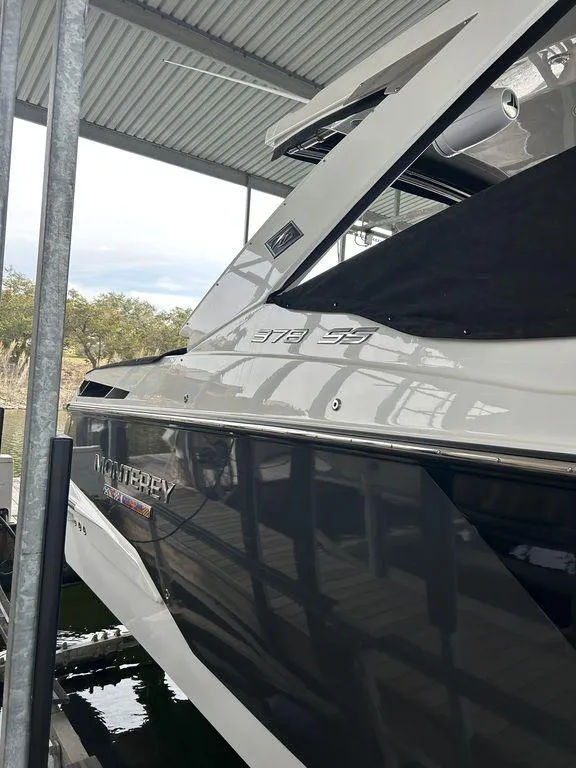 Slide: The Image of 2023 Monterey 378SS boat docked in a covered marina. - 10