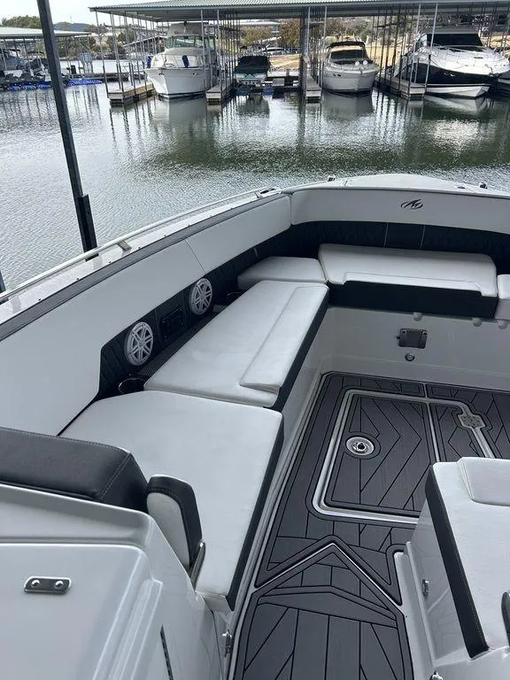 Slide: The Image of 2023 Monterey 378SS boat interior with white seating and modern dashboard. - 20