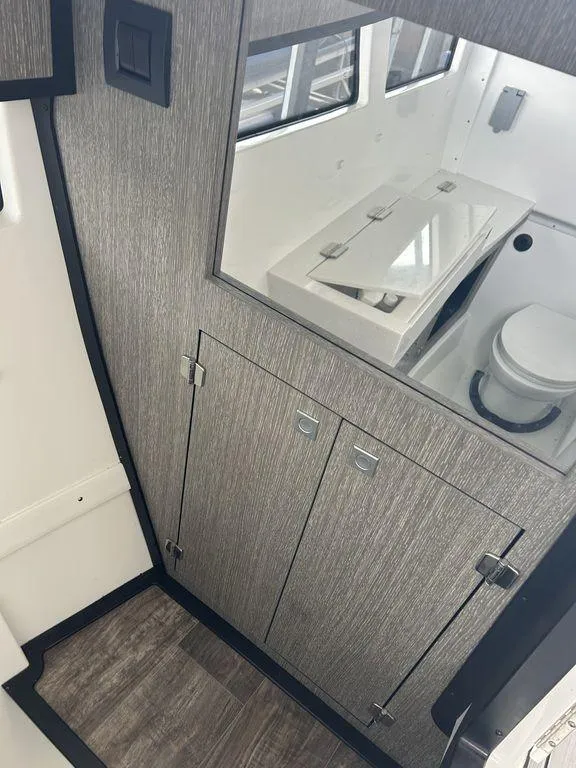 Slide: The Image of 2023 Monterey 378SS boat interior with white seating and modern design. - 24