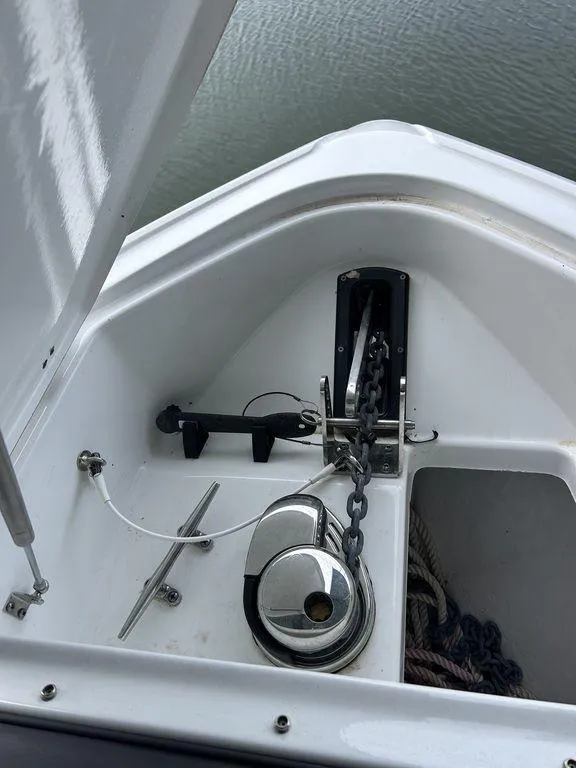 Slide: The Image of 2023 Monterey 378SS boat interior with cushioned seating, docked at marina. - 29