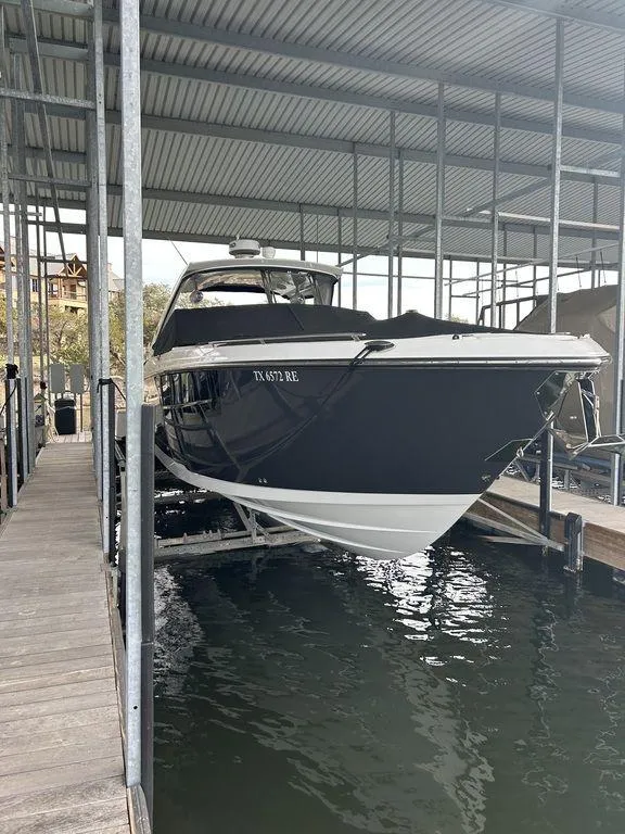 Slide: The Image of 2023 Monterey 378SS Super Sport boat on a serene lake. - 3