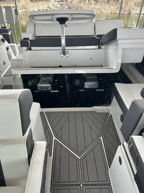 Slide: The Image of 2023 Monterey 378SS interior with modern seating, geometric bedding, and sleek design elements. - 63