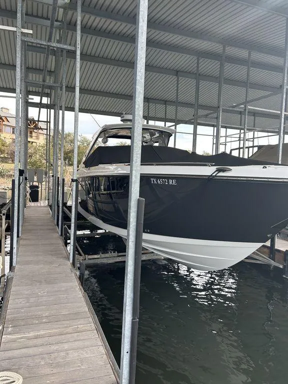 Slide: The Image of 2023 Monterey 378SS Super Sport boat on a calm lake. - 8