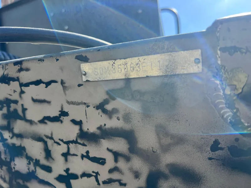 Slide: The Image of Close-up of a 2012 SeaArk 1872 boat's identification plate with sunlight glare. - 24
