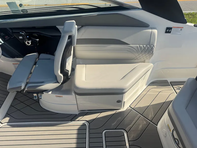 Slide: The Image of 2025 Sea Ray SLX 260 boat interior with sleek seating and modern design. - 10