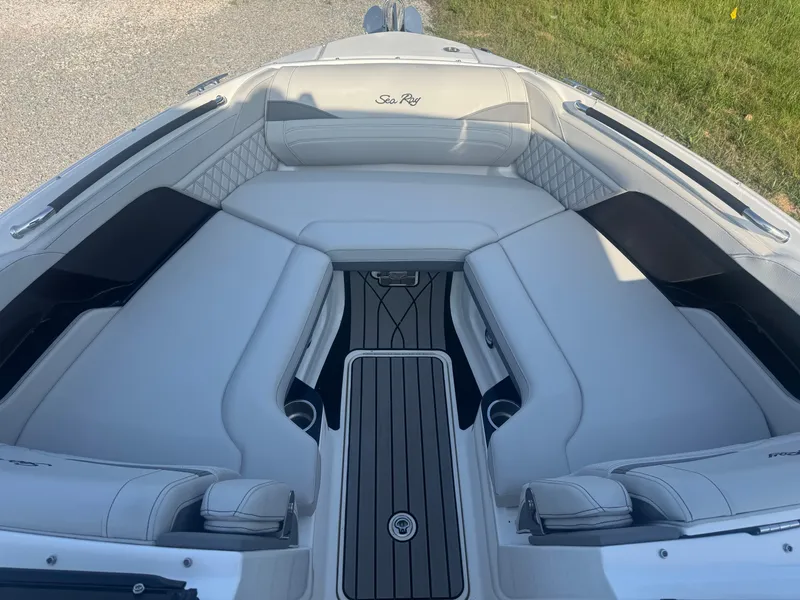 Slide: The Image of 2025 Sea Ray SLX 260 boat interior with luxurious seating and sleek design. - 17