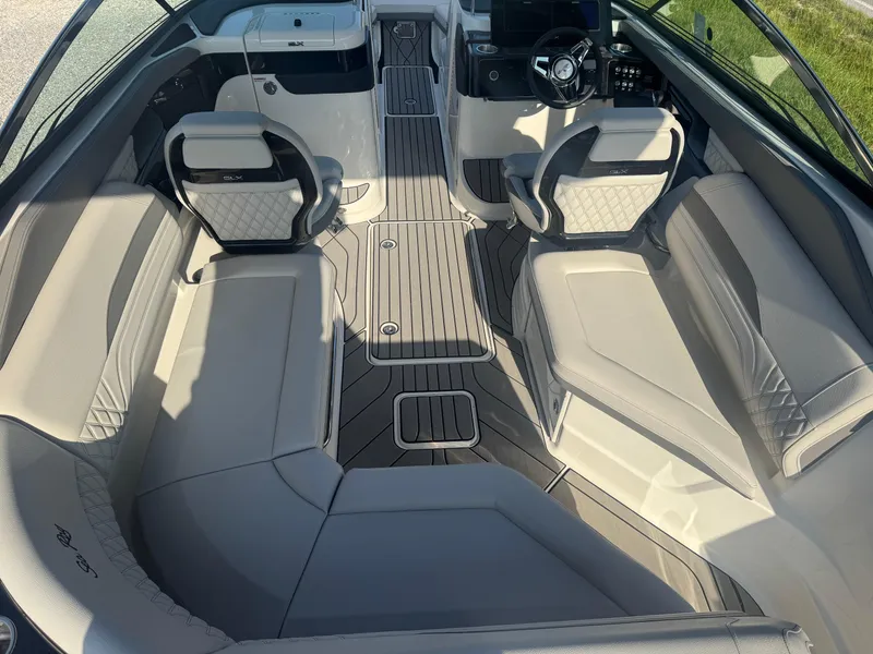 Slide: The Image of 2025 Sea Ray SLX 260 boat interior with luxurious seating and modern design. - 8