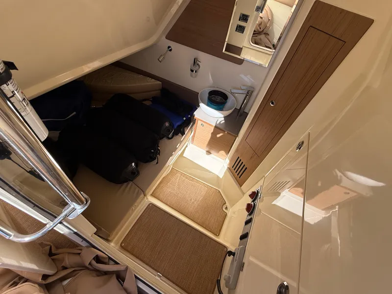 Slide: The Image of Interior cabin of 2022 Chris-Craft Catalina 30, featuring compact design and amenities. - 11