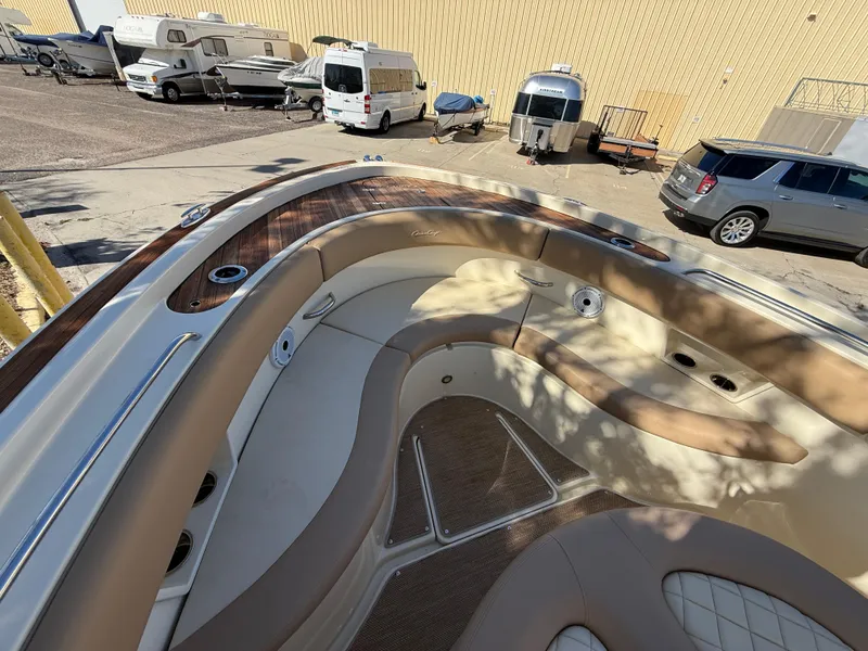 Slide: The Image of 2022 Chris-Craft Catalina 30 boat interior with luxurious seating and wood accents. - 14