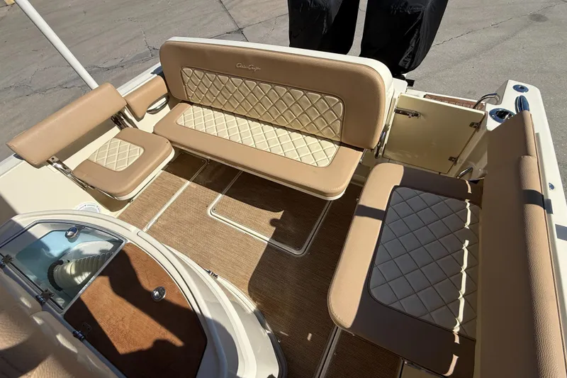 Slide: The Image of 2022 Chris-Craft Catalina 30 interior with beige diamond-stitched seating and elegant design. - 6