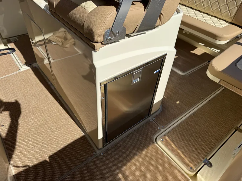 Slide: The Image of 2022 Chris-Craft Catalina 30 interior with seating and built-in storage. - 7