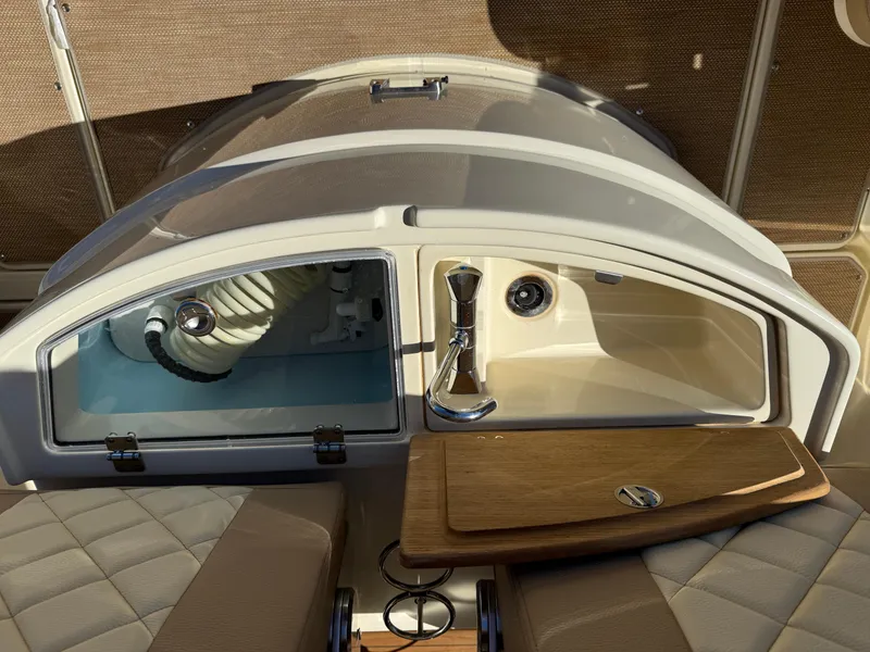 Slide: The Image of 2022 Chris-Craft Catalina 30 dashboard with modern controls and wood accents. - 8