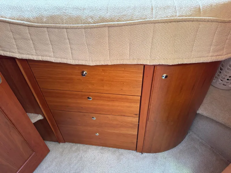 Slide: The Image of Wooden drawers and cabinet in a 2003 Silverton 39 Motor Yacht interior. - 28