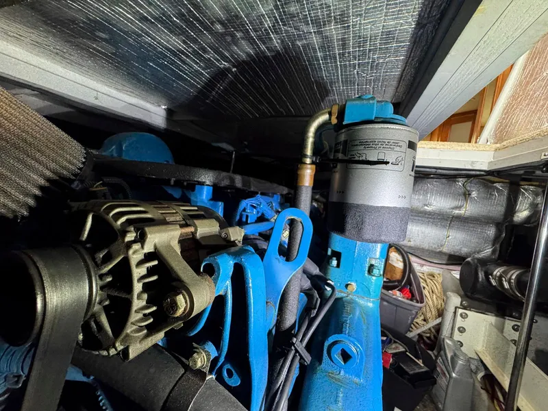 Slide: The Image of Engine compartment of a 2003 Silverton 39 Motor Yacht, showcasing mechanical components. - 35