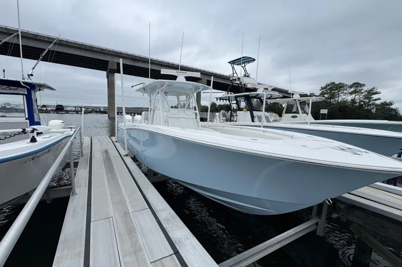 Slide: The Image of 2021 Invincible 36 Open Fisherman boat docked under bridge. - 13