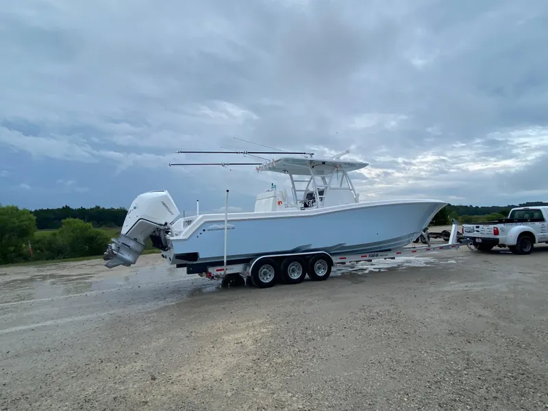 Slide: The Image of 2021 Invincible 36 Open Fisherman boat on trailer, parked outdoors. - 3