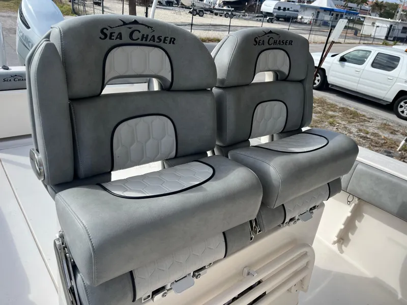 Slide: The Image of 2025 Sea Chaser 30 HFC CC boat seats, gray upholstery, outdoor setting. - 10