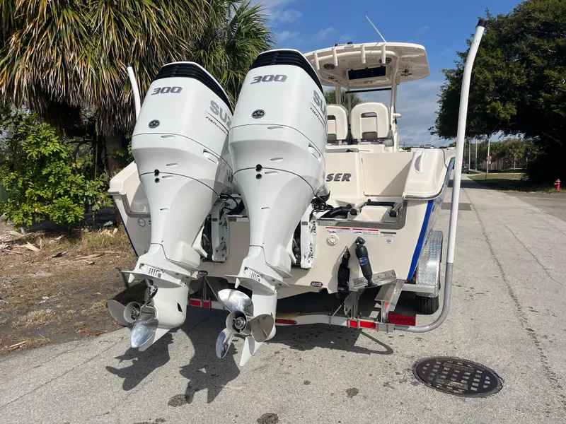 Slide: The Image of 2025 Sea Chaser 30 HFC CC boat with dual 300 horsepower engines on a trailer. - 3