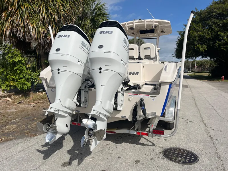 Slide: The Image of 2025 Sea Chaser 30 HFC CC boat with twin 300 HP engines on a sunny day. - 4